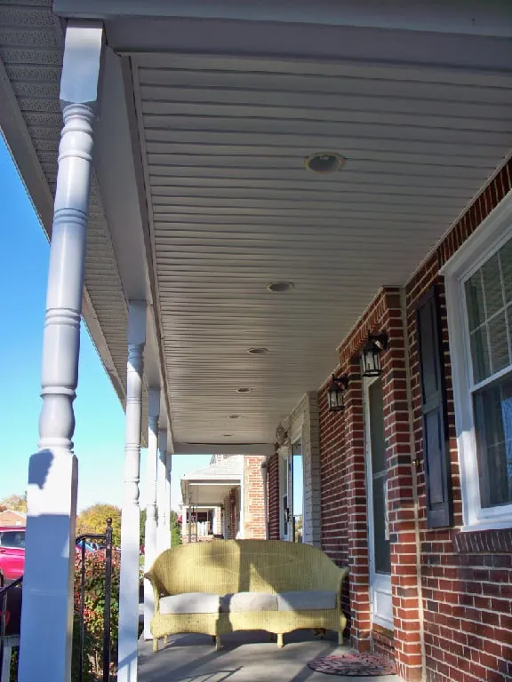 Recessed lights in a front porch ceiling
